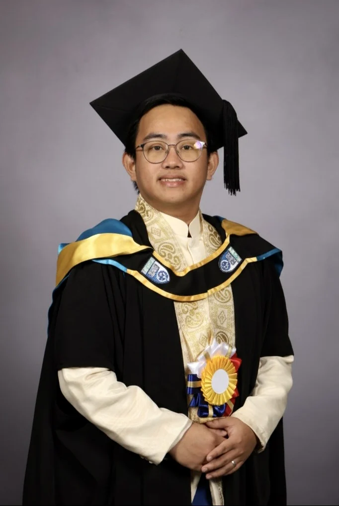 Kenneth Bernardino in graduation attire